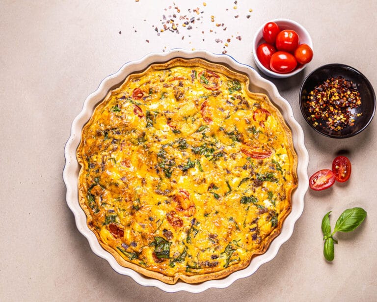 This is an image of a high-protein tortilla quiche in a baking dish