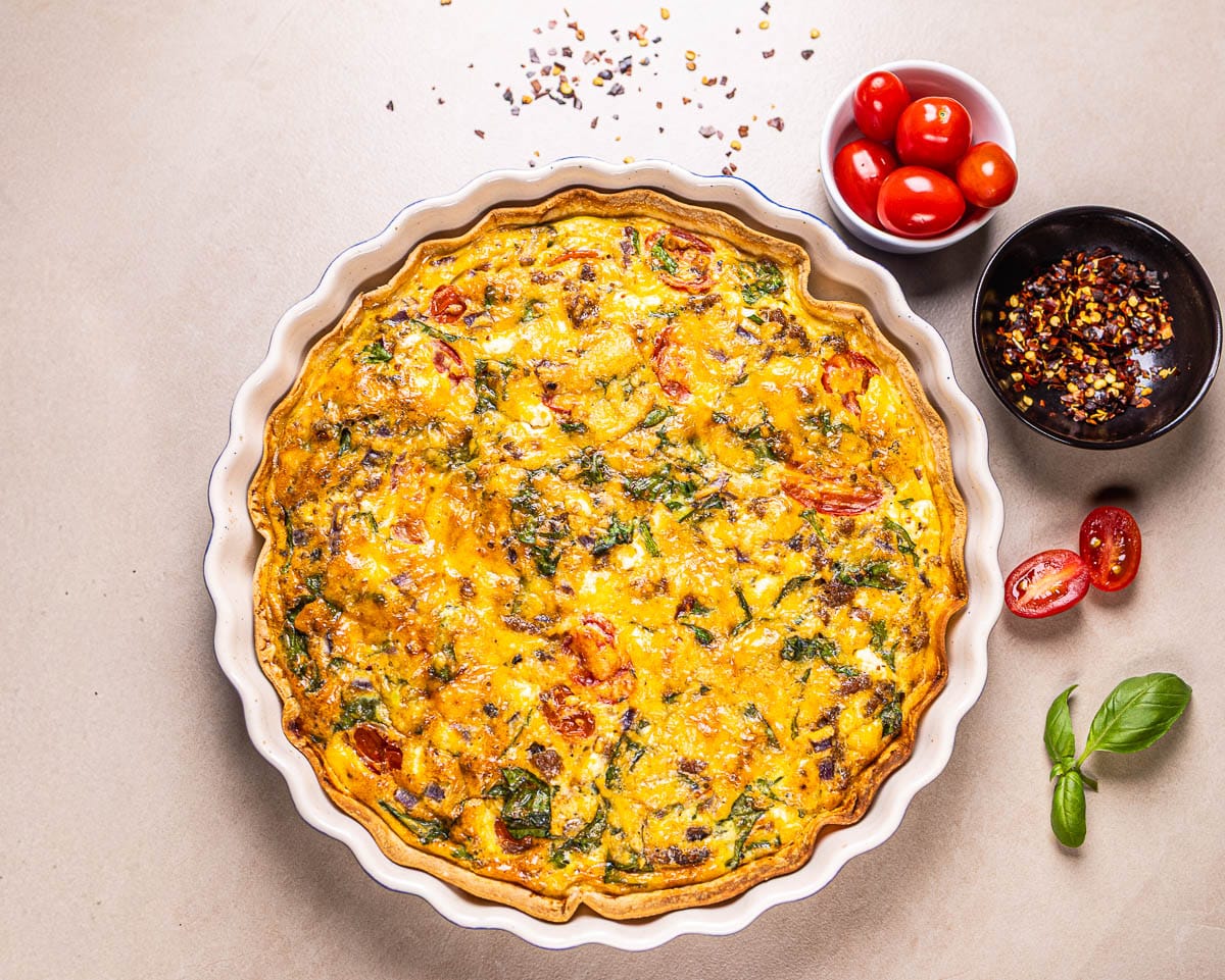 This is an image of a high-protein tortilla quiche in a baking dish