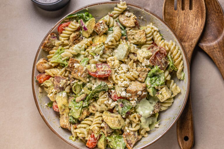 This is a photo of a pasta salad with lime dressing in a plate