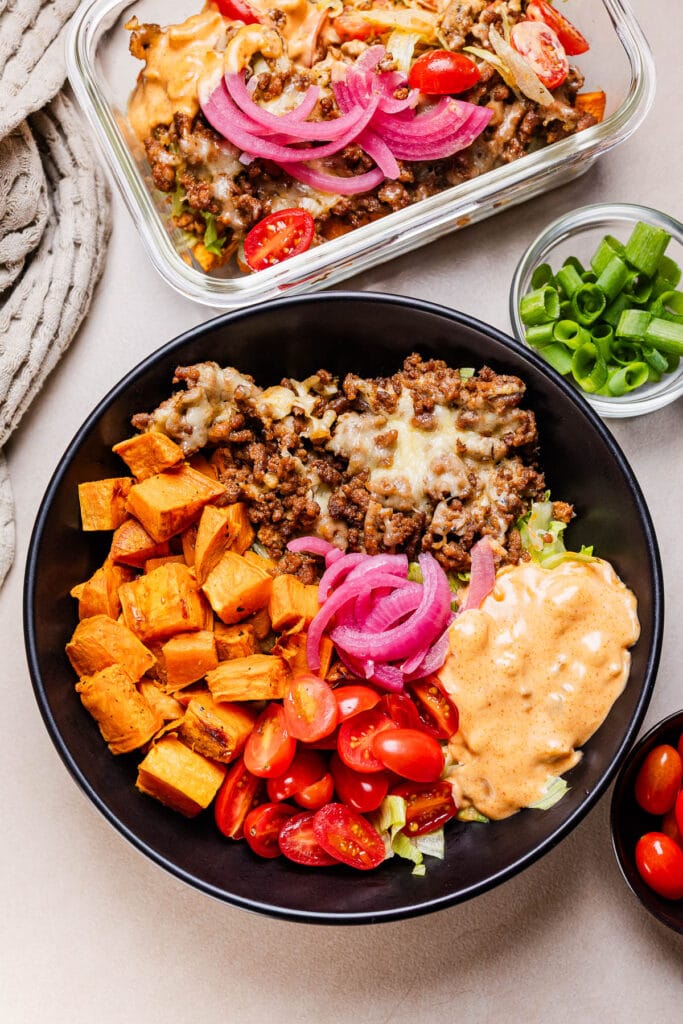 This a photo of the viral cheese burger bowl in a black bowl.