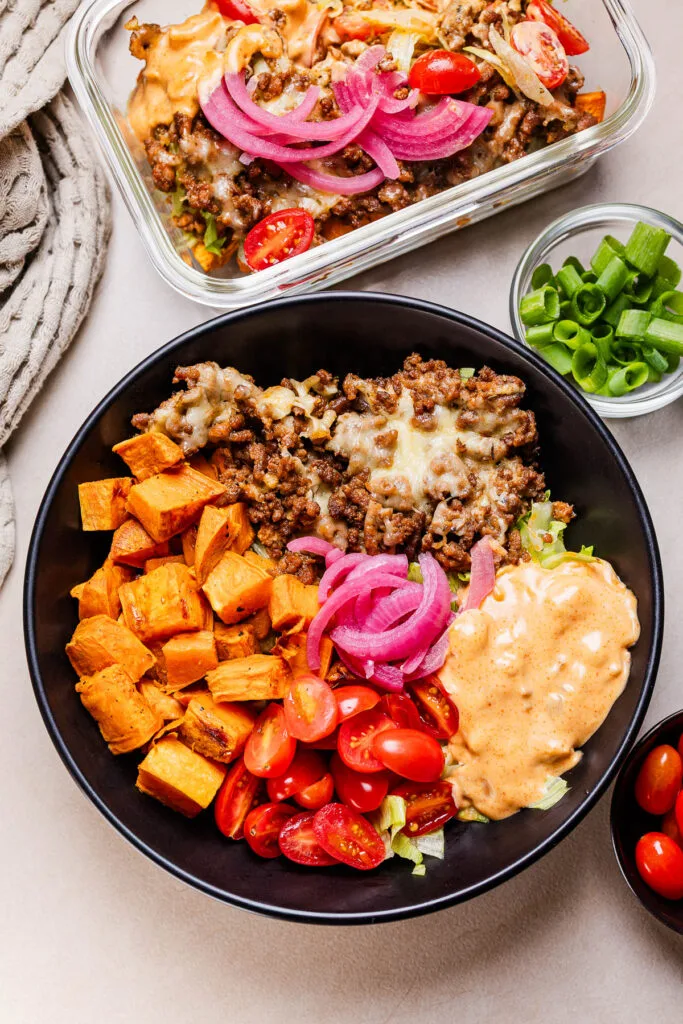 This a photo of the viral cheese burger bowl in a black bowl.