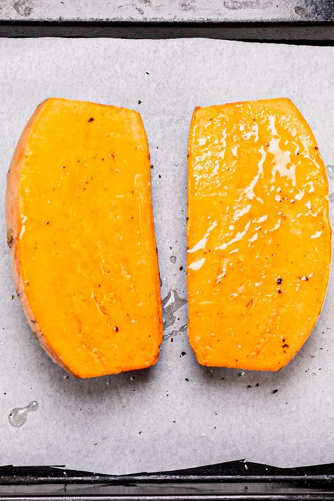 This is an image of  halved sweet potato about to be baked.