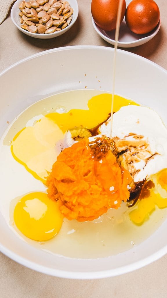 Pumpkin pancake batter being mixed in a bowl