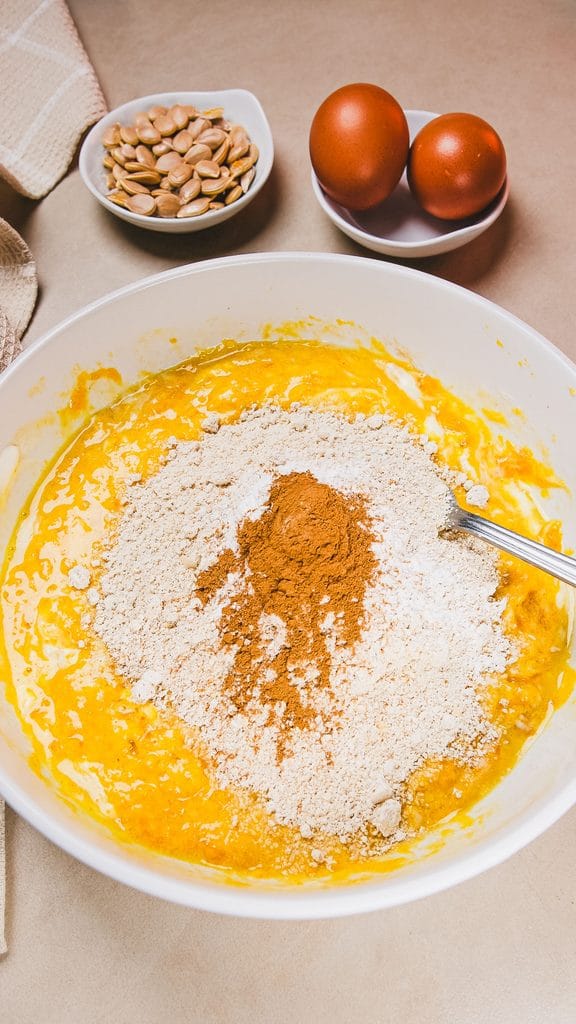 Pumpkin pancake batter being mixed in a bowl